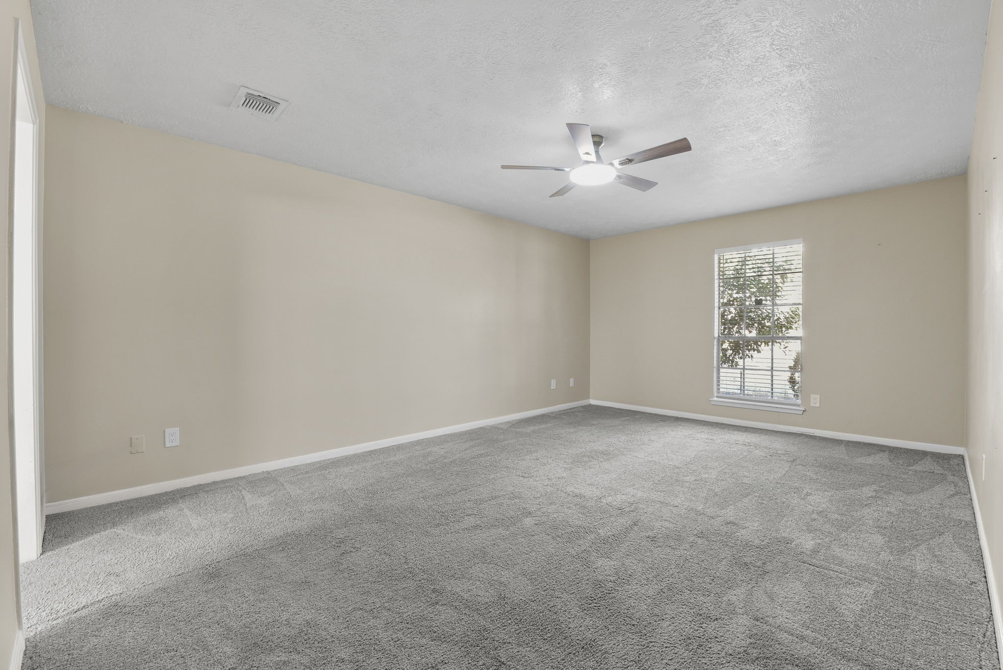 6507 Spring Leaf Drive Spring, TX 77379 - Photo 20 of 34 an empty room with windows and fan