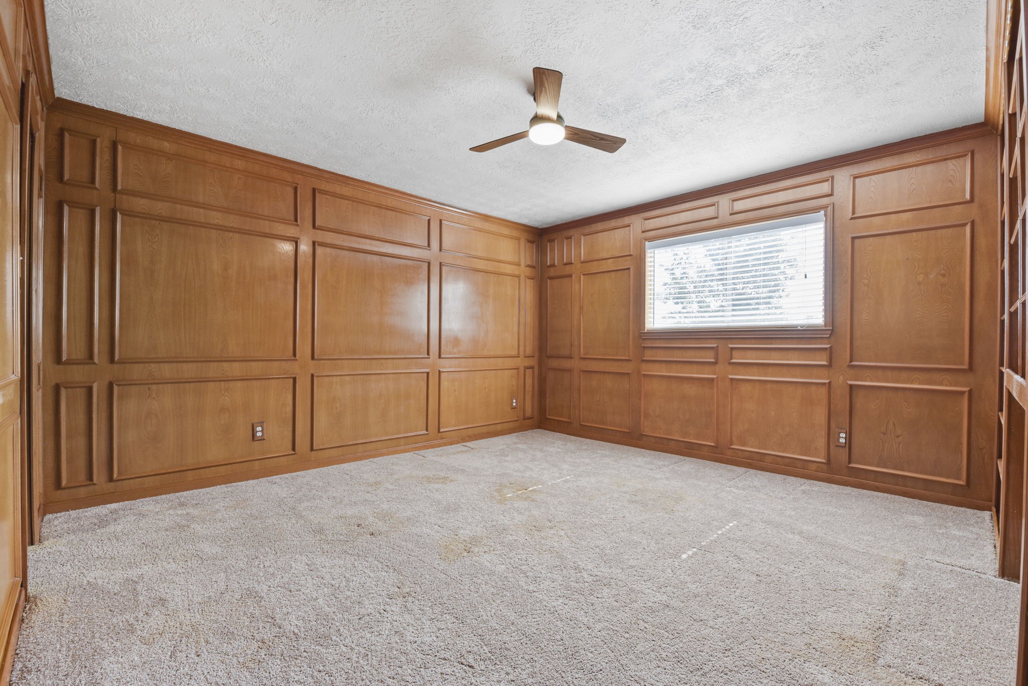 6507 Spring Leaf Drive Spring, TX 77379 - Photo 22 of 34 an empty room with windows & cabinet ceiling fan