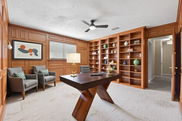 a workspace with furniture and window