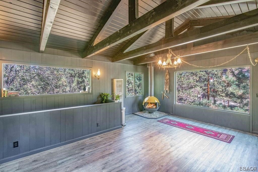 186 Riverside Avenue Sugarloaf, CA 92386 - Photo 12 of 34 a view of play room with wooden floor