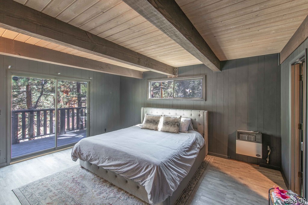 186 Riverside Avenue Sugarloaf, CA 92386 - Photo 20 of 34 a bedroom with a bed and a large window