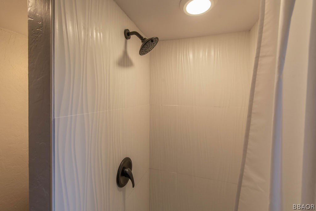 186 Riverside Avenue Sugarloaf, CA 92386 - Photo 26 of 34 a view of a bathroom from a shower