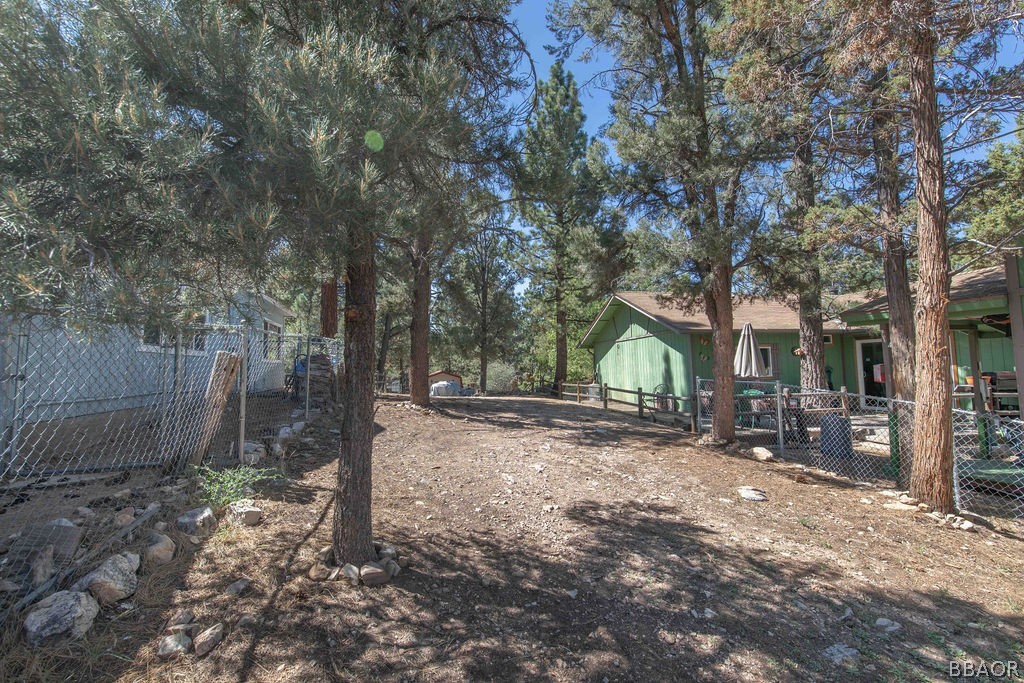 186 Riverside Avenue Sugarloaf, CA 92386 - Photo 34 of 34 a backyard of a house with lots of green space