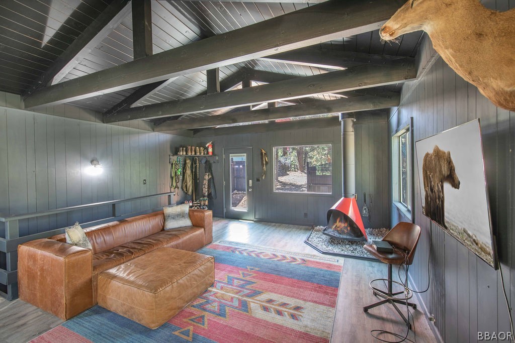 186 Riverside Avenue Sugarloaf, CA 92386 - Photo 4 of 34 a living room with furniture gym equipment and a large window
