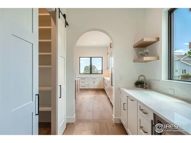 a view of a bathroom with a sink and a mirror