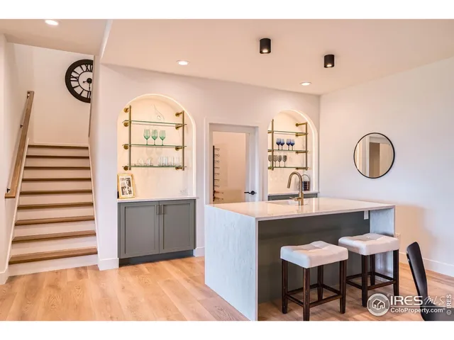 a view of kitchen with a sink and a refrigerator