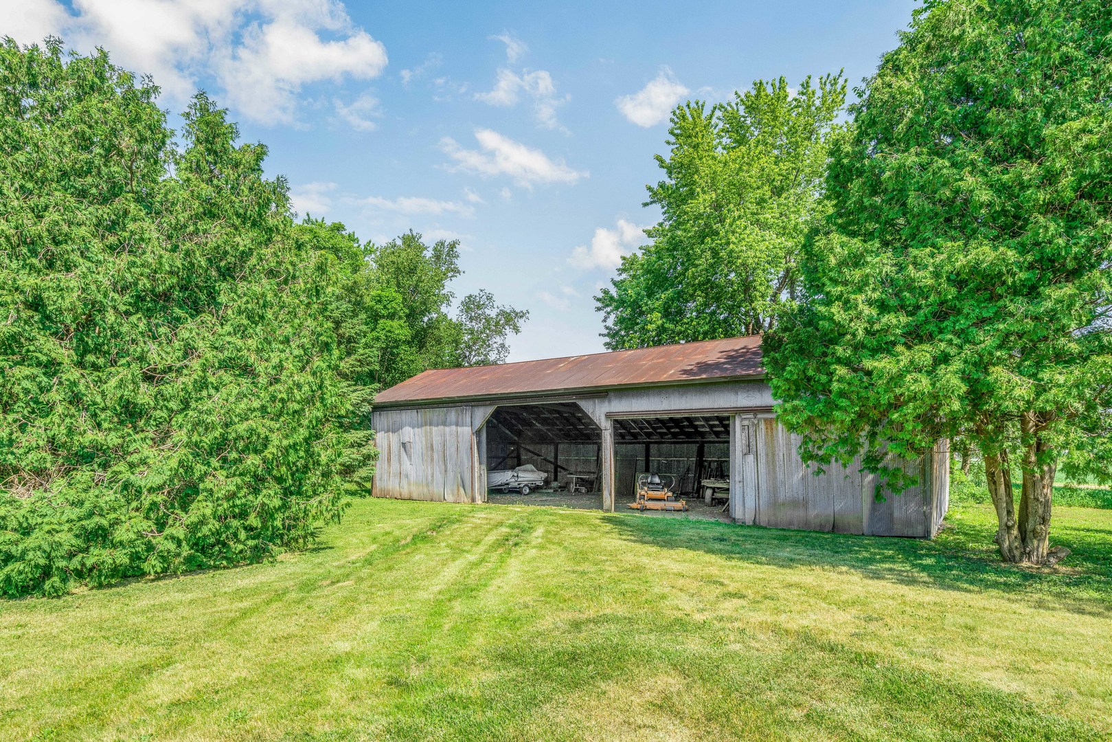 3700 Kane Road Leland, IL 60531 - Photo 12 of 30 a view of a house with a yard and large tree