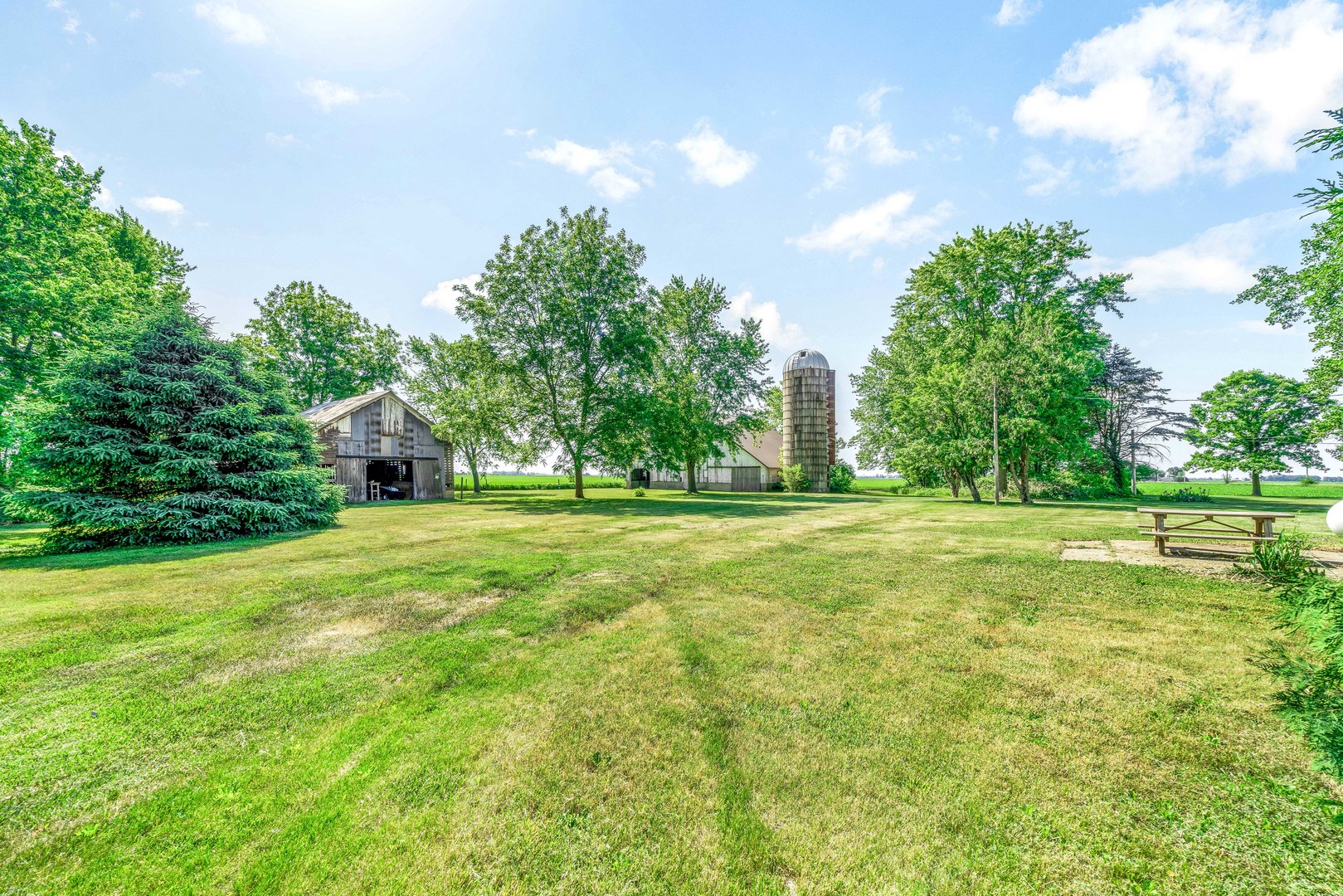 3700 Kane Road Leland, IL 60531 - Photo 23 of 30 a backyard of a house with lots of green space and garden