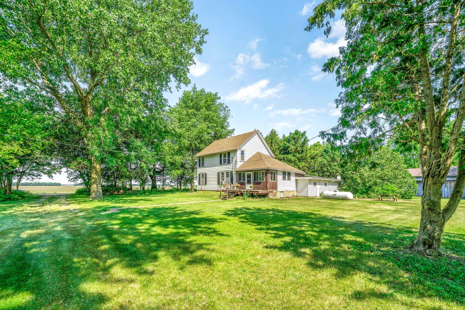 3700 Kane Road Leland, IL 60531 - Photo 30 of 30 a view of a house with a big yard and large trees