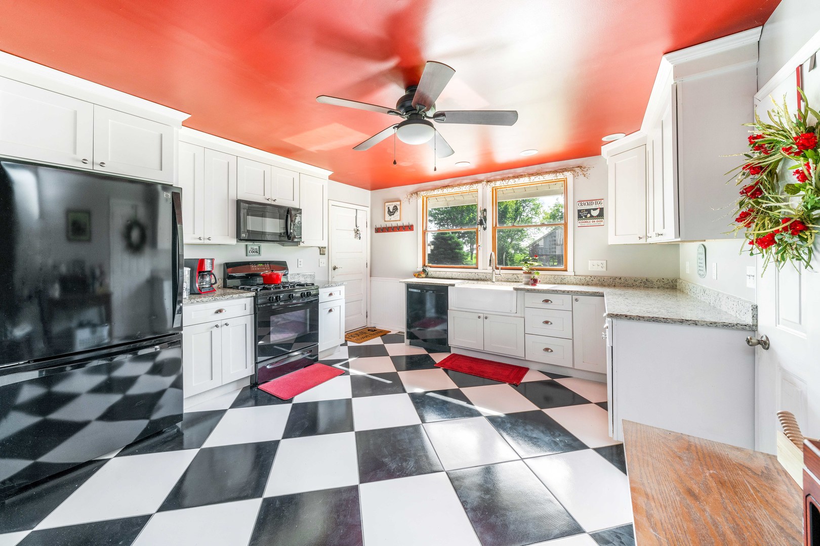 3700 Kane Road Leland, IL 60531 - Photo 3 of 30 a kitchen with a stove a sink and a microwave