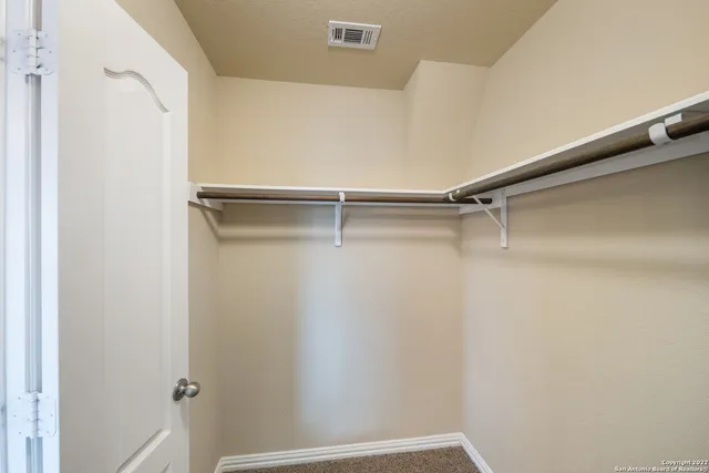 a view of a room with racks on the wall