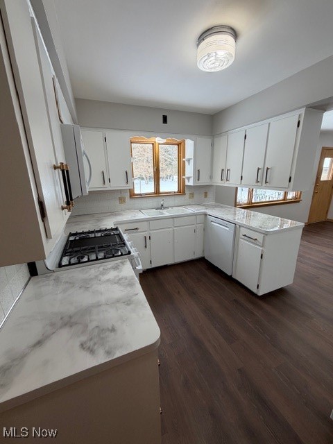 1933 Arndale Road Stow, OH 44224 - Photo 7 of 21 Kitchen with light countertops, a peninsula, white cabinets, and dark wood finished floors
