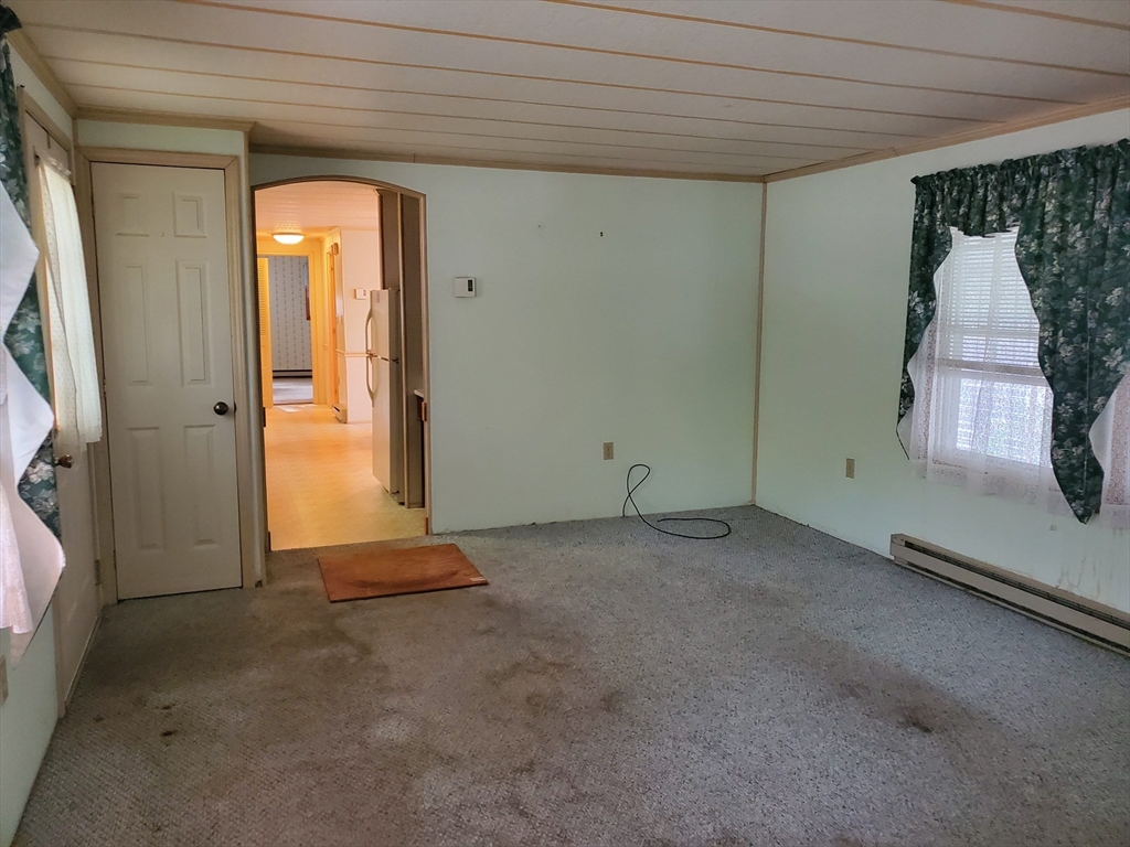 10 5th Street Brookfield, MA 01506 - Photo 14 of 17 a view of a room with a fireplace and windows