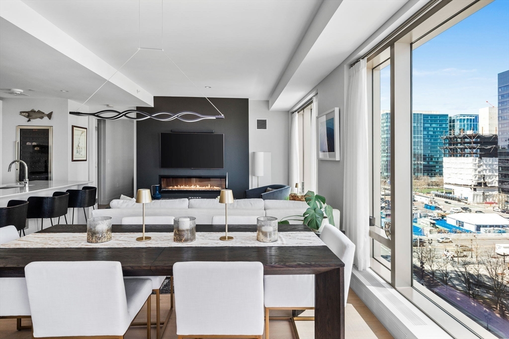 133 Seaport Boulevard, Unit 920 Boston, MA 02210 - Photo 13 of 28 a dining room with a large window and table