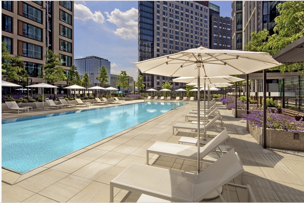 133 Seaport Boulevard, Unit 920 Boston, MA 02210 - Photo 25 of 28 a view of a swimming pool with a lounge chairs