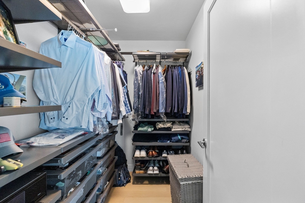 133 Seaport Boulevard, Unit 920 Boston, MA 02210 - Photo 7 of 28 a view of room with furniture and a rug