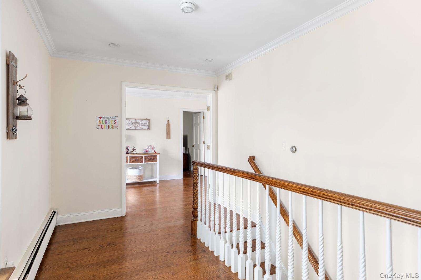 33 Beach Road Northport, NY 11768 - Photo 32 of 50 a view of a hallway with wooden floor and entryway