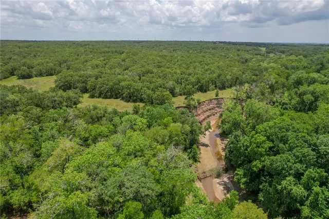 a view of a big yard with houses