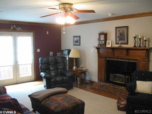 10220 Nestor Road Chesterfield, VA 23838 - Photo 3 of 4 a living room with furniture and a fireplace