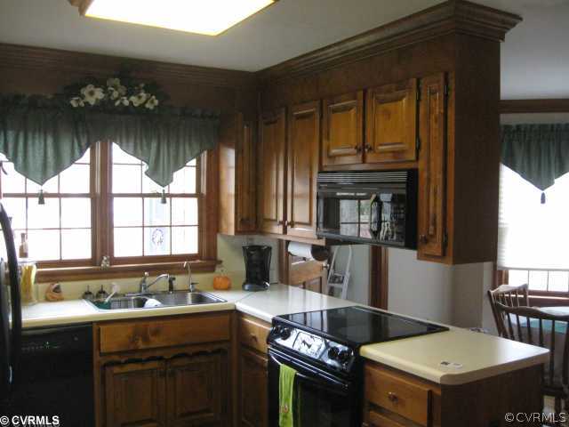 10220 Nestor Road Chesterfield, VA 23838 - Photo 4 of 4 a kitchen that has a sink and a stove