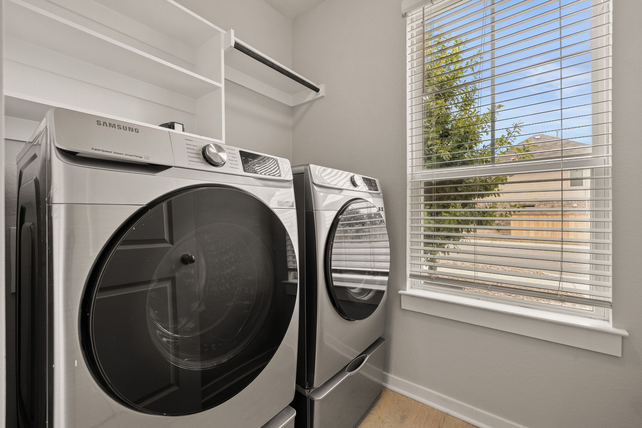 2233 Calvert Drive Leander, TX 78641 - Photo 27 of 32 The laundry room is found on the main level with great storage above.