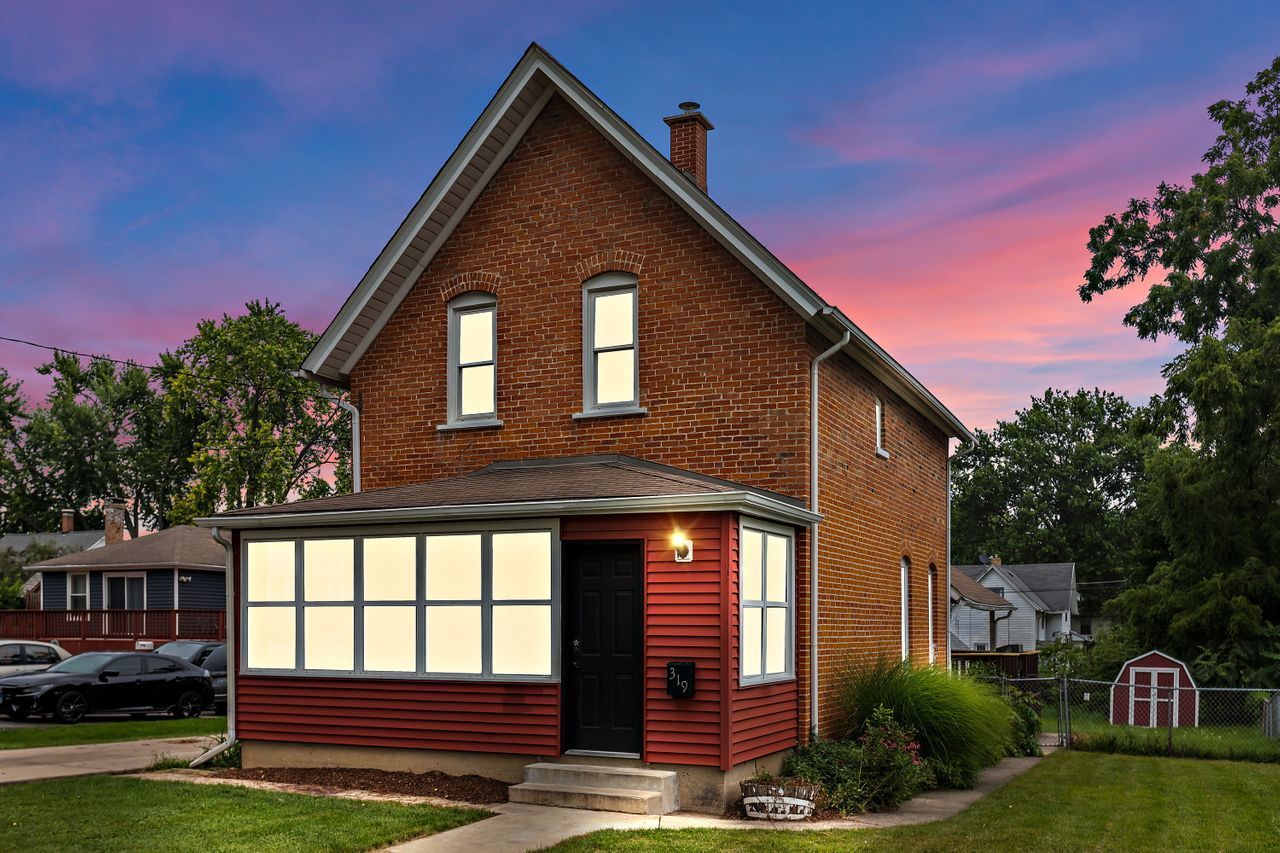 319 Wabash Street Elgin, IL 60123 - Photo 18 of 18 a front view of a house with a yard