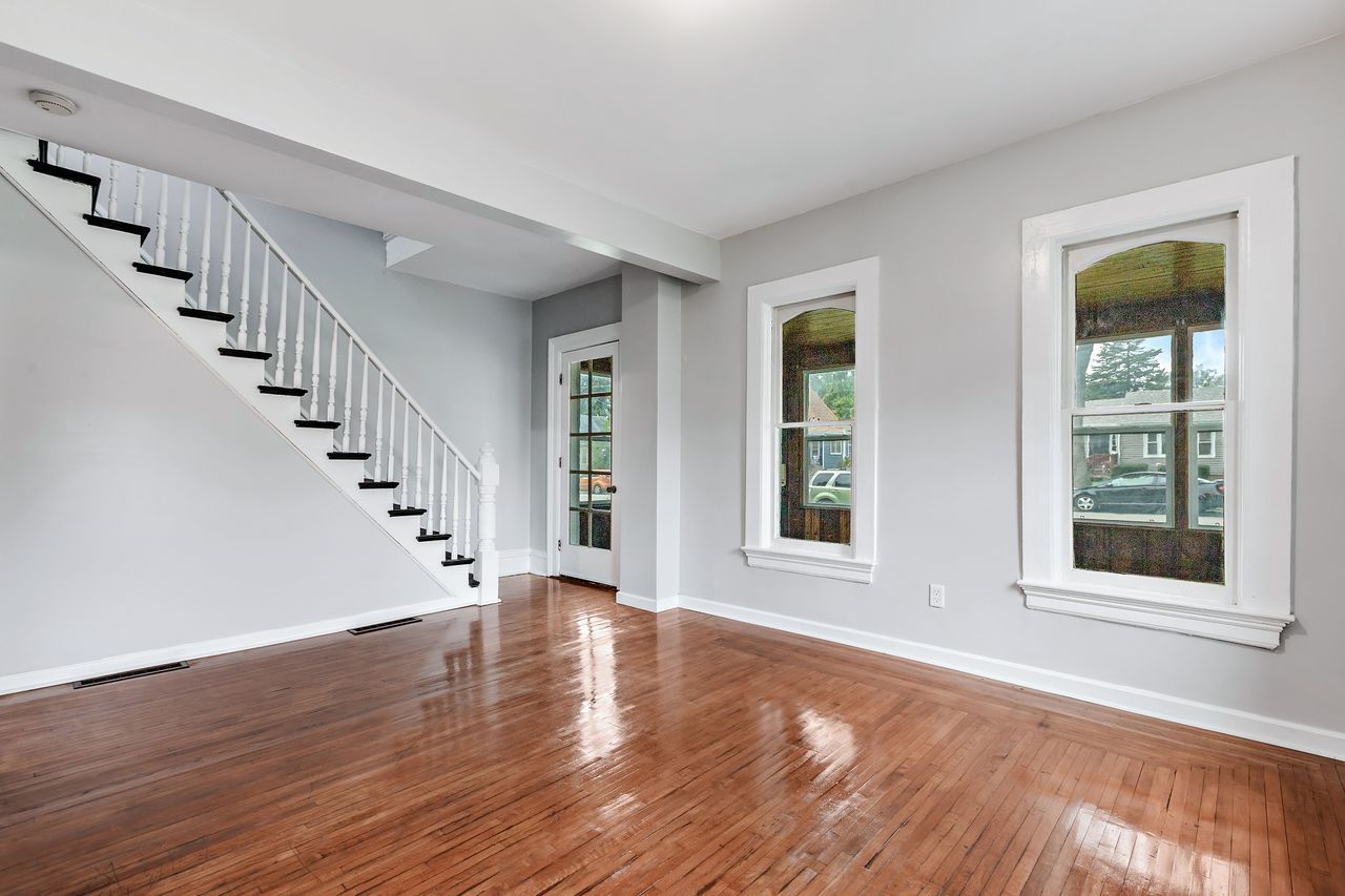 319 Wabash Street Elgin, IL 60123 - Photo 2 of 18 a view of an entryway with wooden floor and stairs