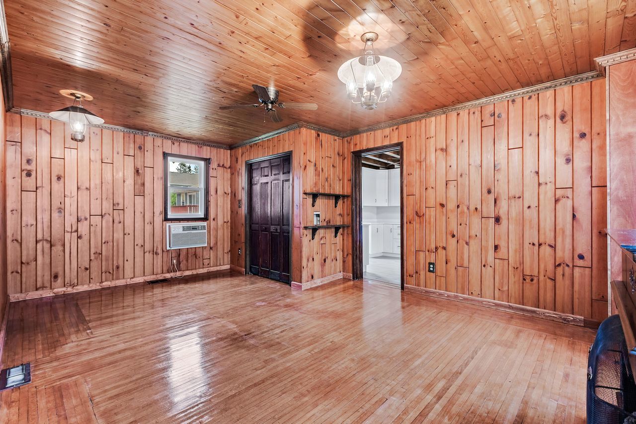 319 Wabash Street Elgin, IL 60123 - Photo 9 of 18 a view of an empty room with wooden floor