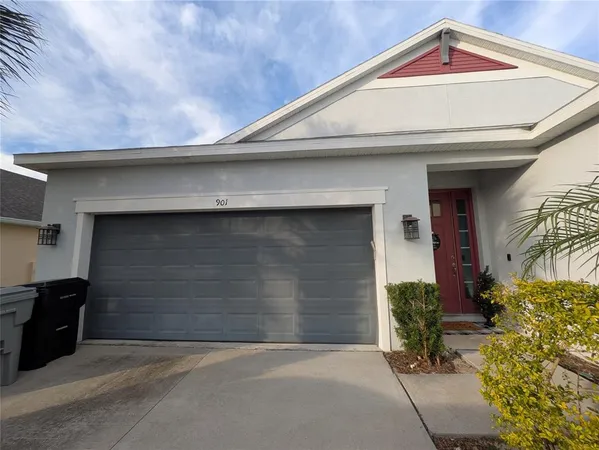 a front view of a house with a garage