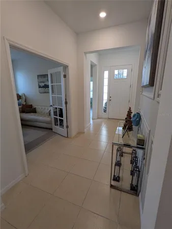 a view of a livingroom with furniture and a window