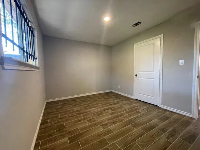a view of an empty room and window