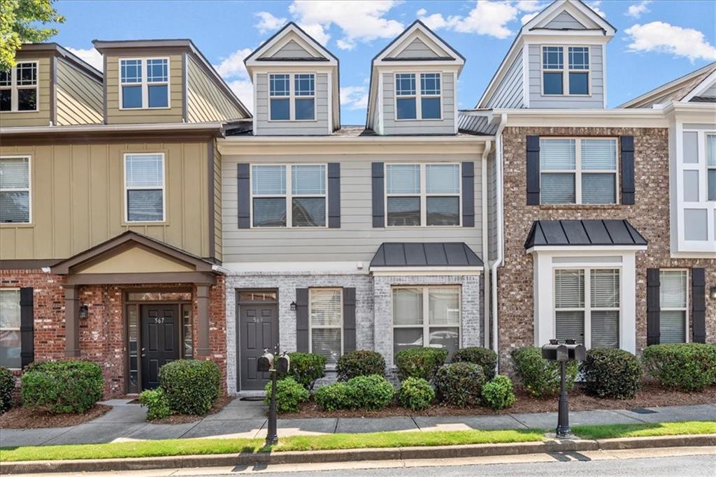 569 Ridge View Crossing Woodstock, GA 30188 - Photo 1 of 1 a front view of a multi story residential apartment building