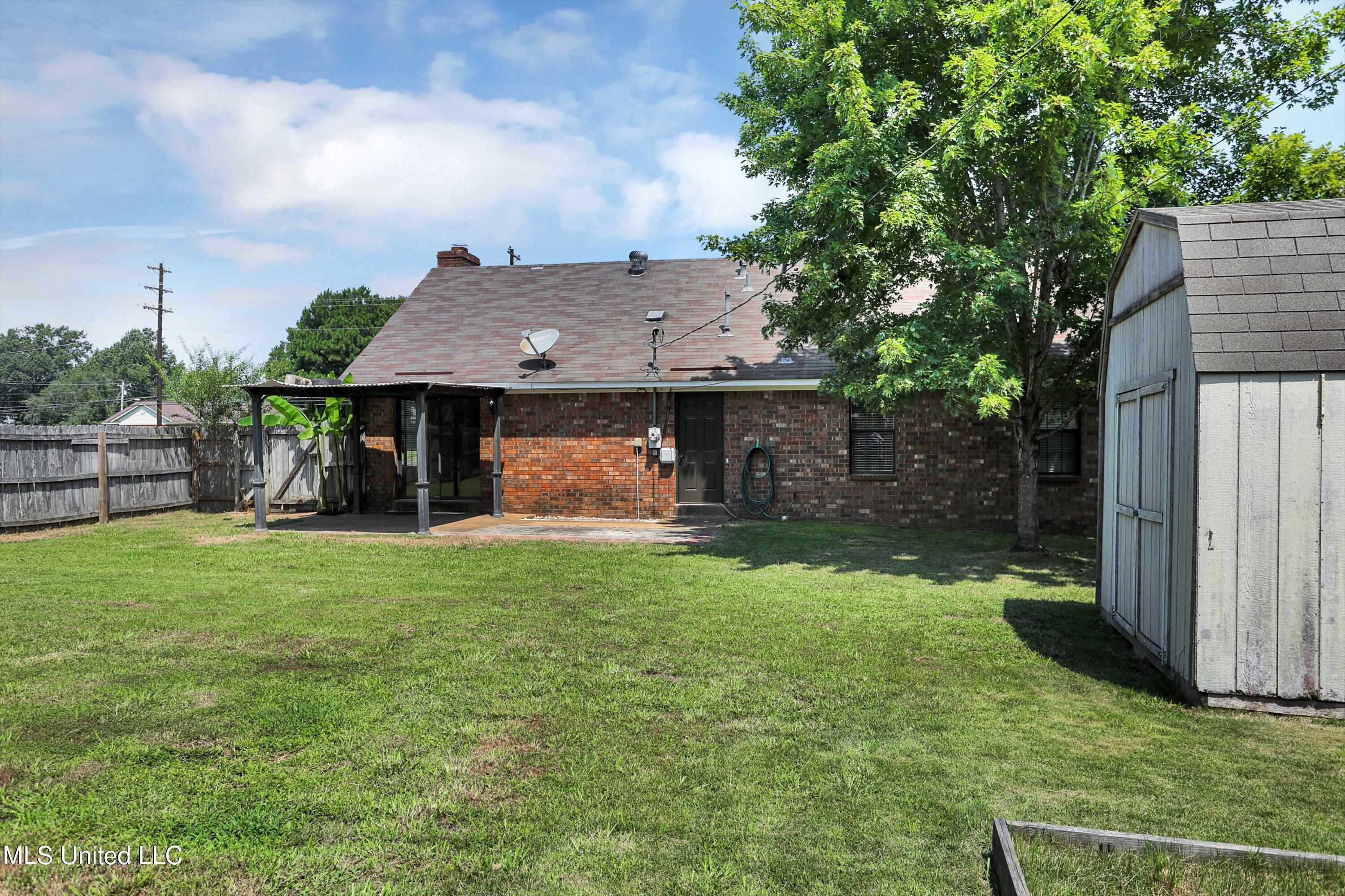 10051 Goodman Road Olive Branch, MS 38654 - Photo 28 of 30 Rear view w/shed and raised garden