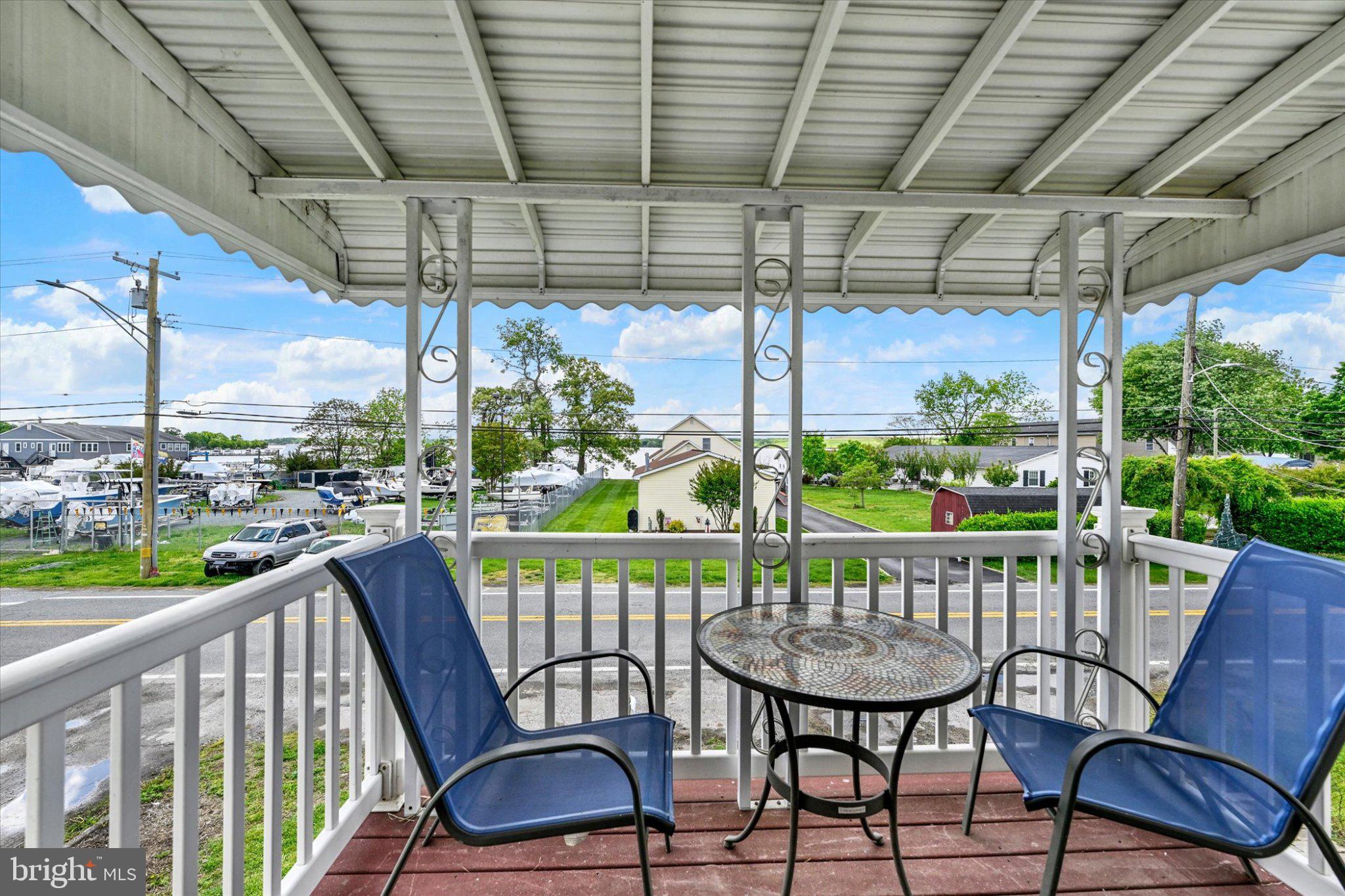 521 Riverside Drive Essex, MD 21221 - Photo 22 of 32 Charming porch with scenic views.