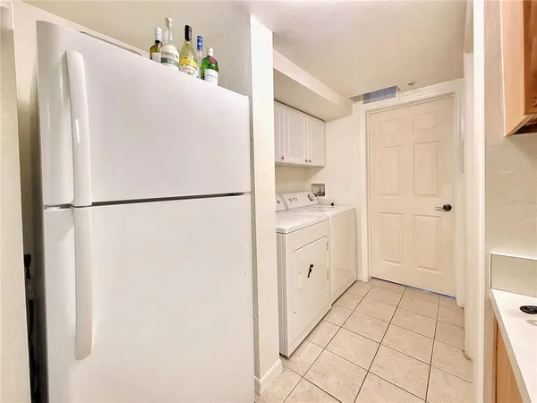a kitchen with a refrigerator a sink and dishwasher