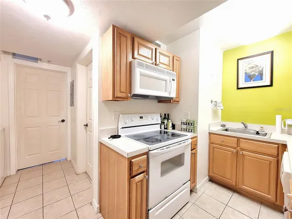 a utility room with sink dryer and washer