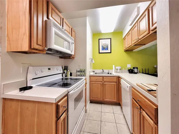 a kitchen with stainless steel appliances granite countertop a stove and a sink