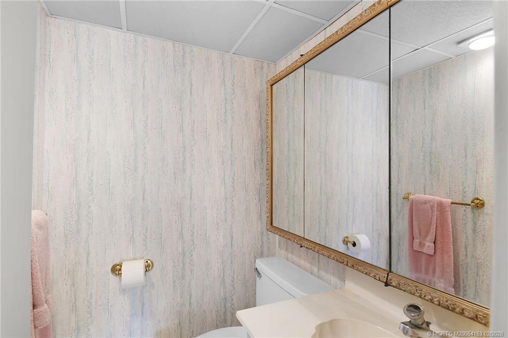 5413 Southeast Miles Grant Road, Unit G206 Stuart, FL 34997 - Photo 20 of 79 a bathroom with a shower and a toilet