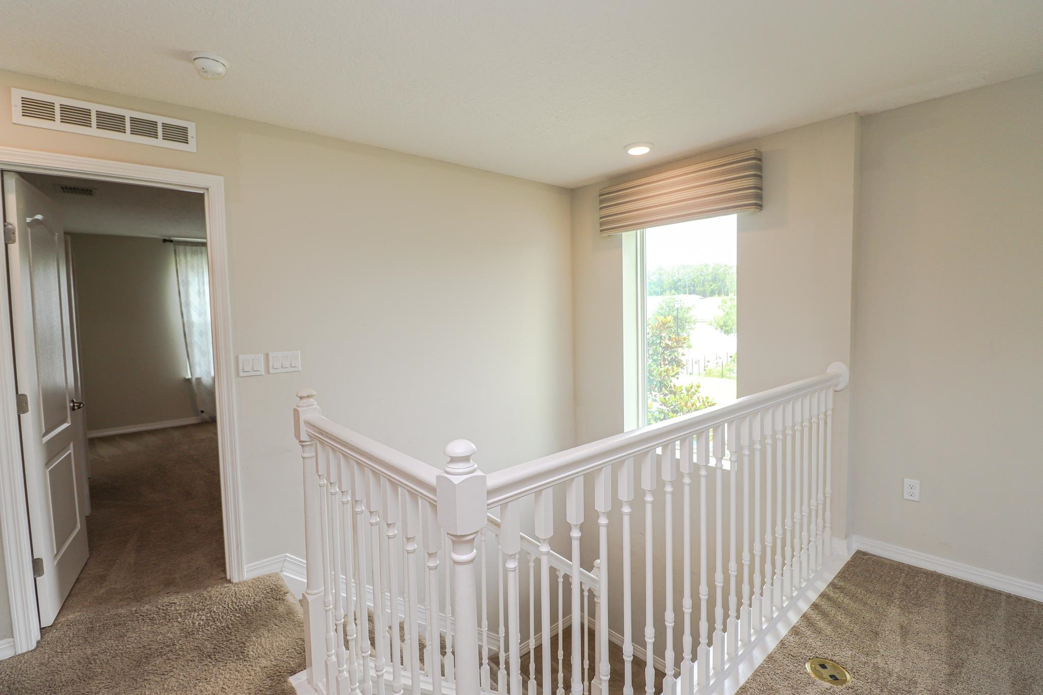 554 Tumbled Stone Way St. Augustine, FL 32086 - Photo 15 of 44 a view of hallway with stairs