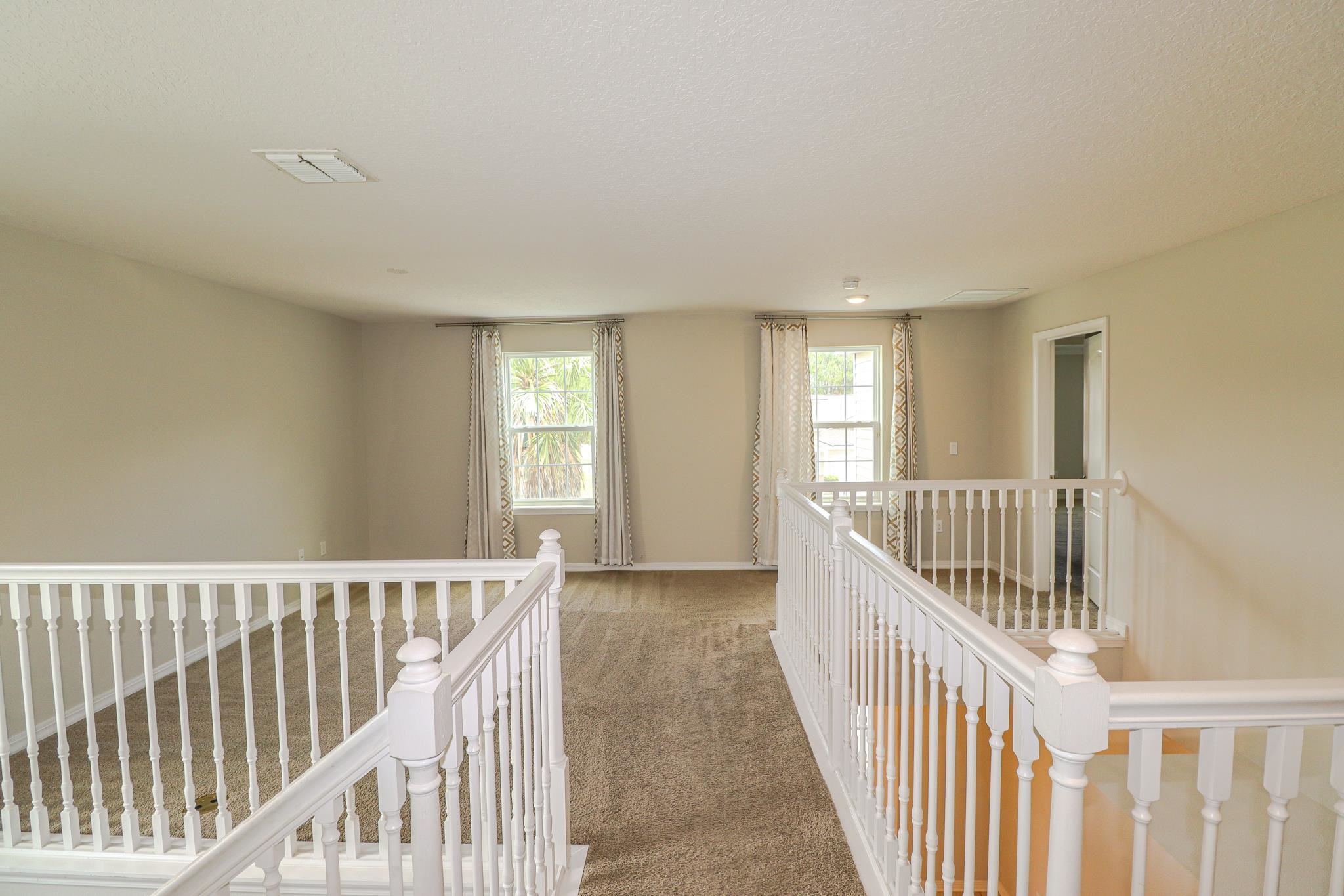 554 Tumbled Stone Way St. Augustine, FL 32086 - Photo 16 of 44 a view of entryway with wooden floor
