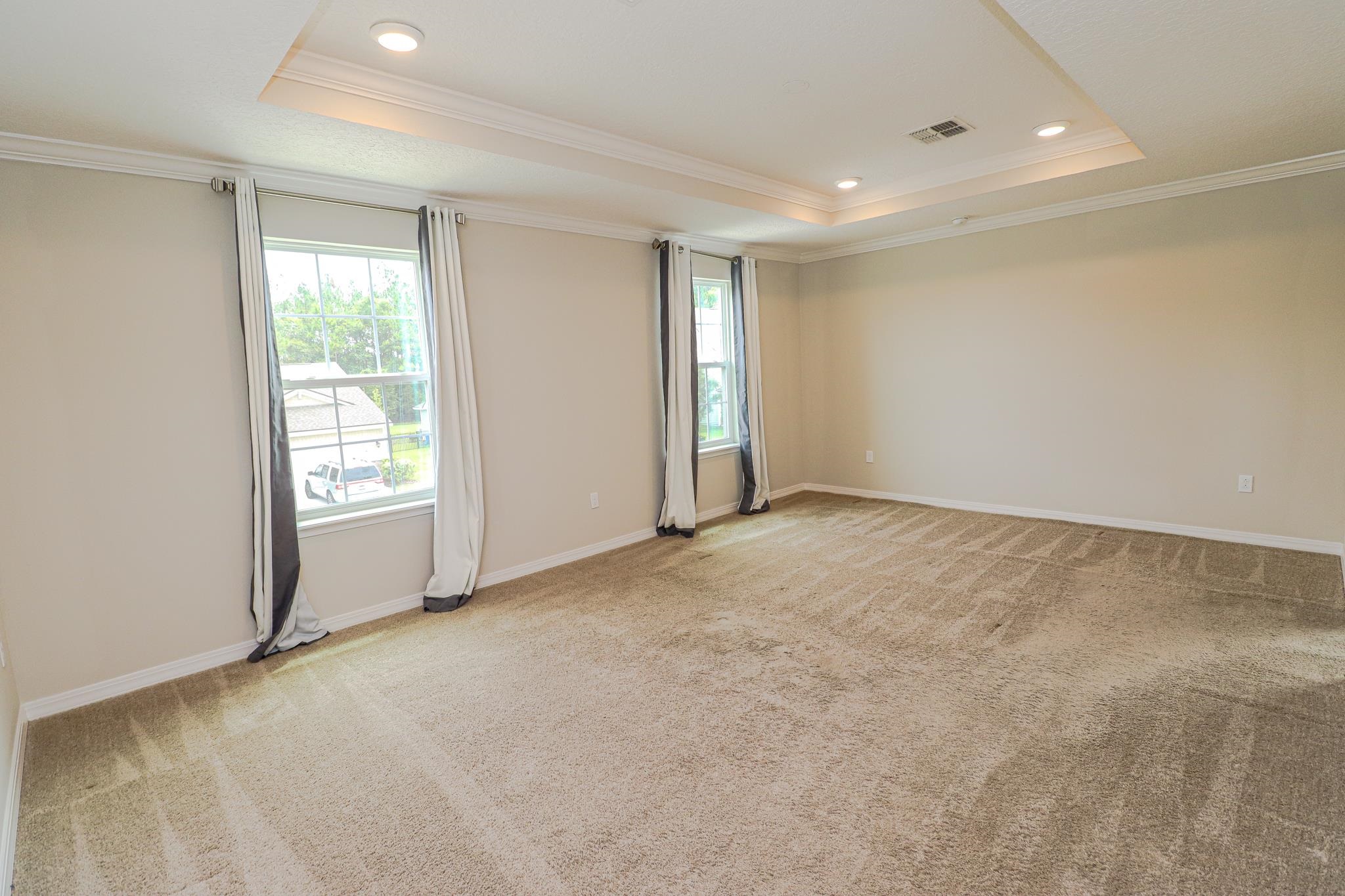 554 Tumbled Stone Way St. Augustine, FL 32086 - Photo 19 of 44 a view of an empty room with a window