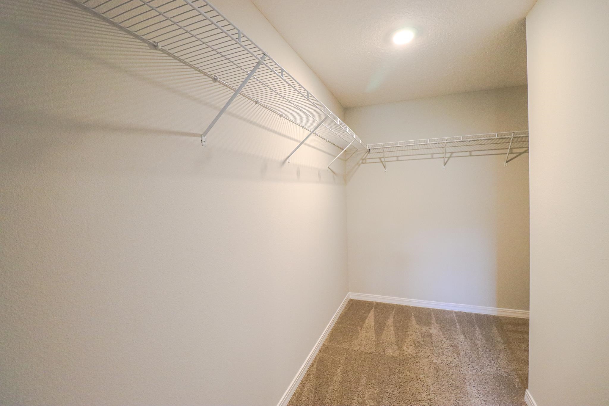 554 Tumbled Stone Way St. Augustine, FL 32086 - Photo 21 of 44 a view of a room with racks on the wall