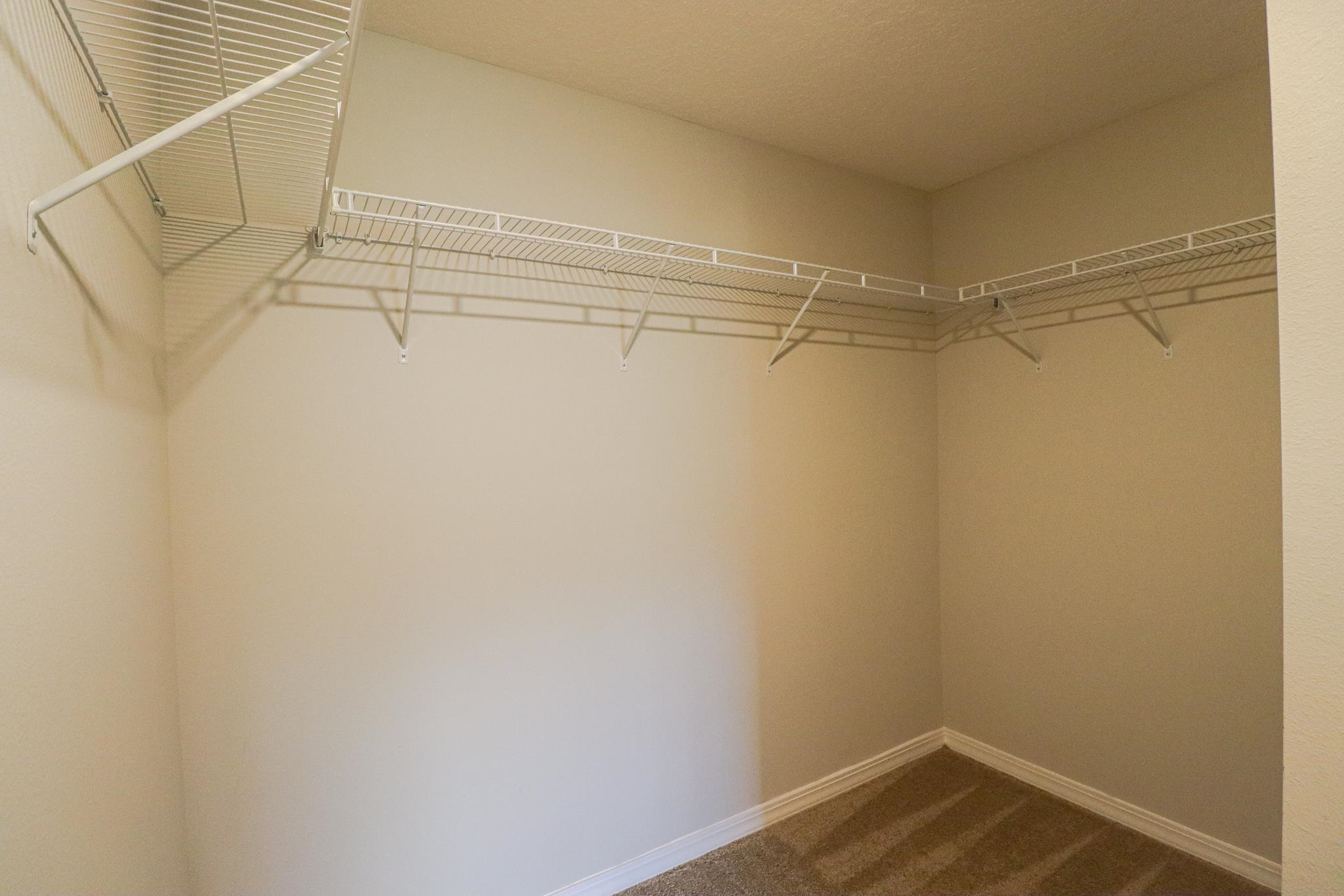 554 Tumbled Stone Way St. Augustine, FL 32086 - Photo 22 of 44 a view of a room with racks on the wall