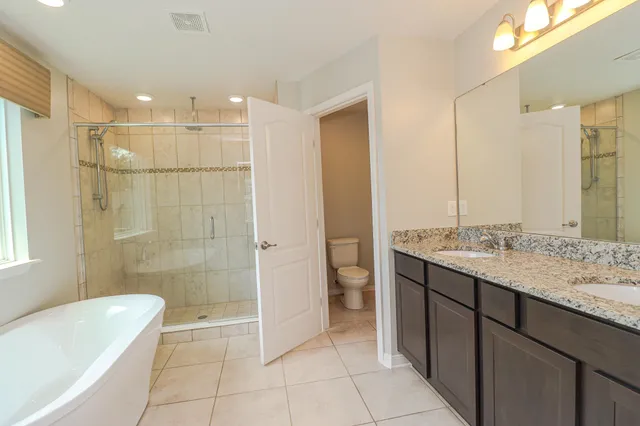 a bathroom with a bathtub and a shower