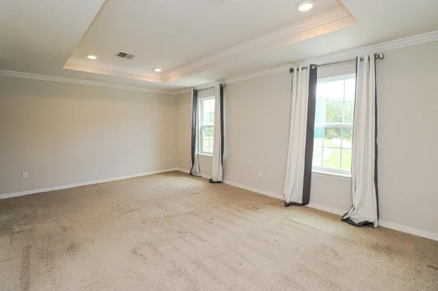 a view of an empty room and window