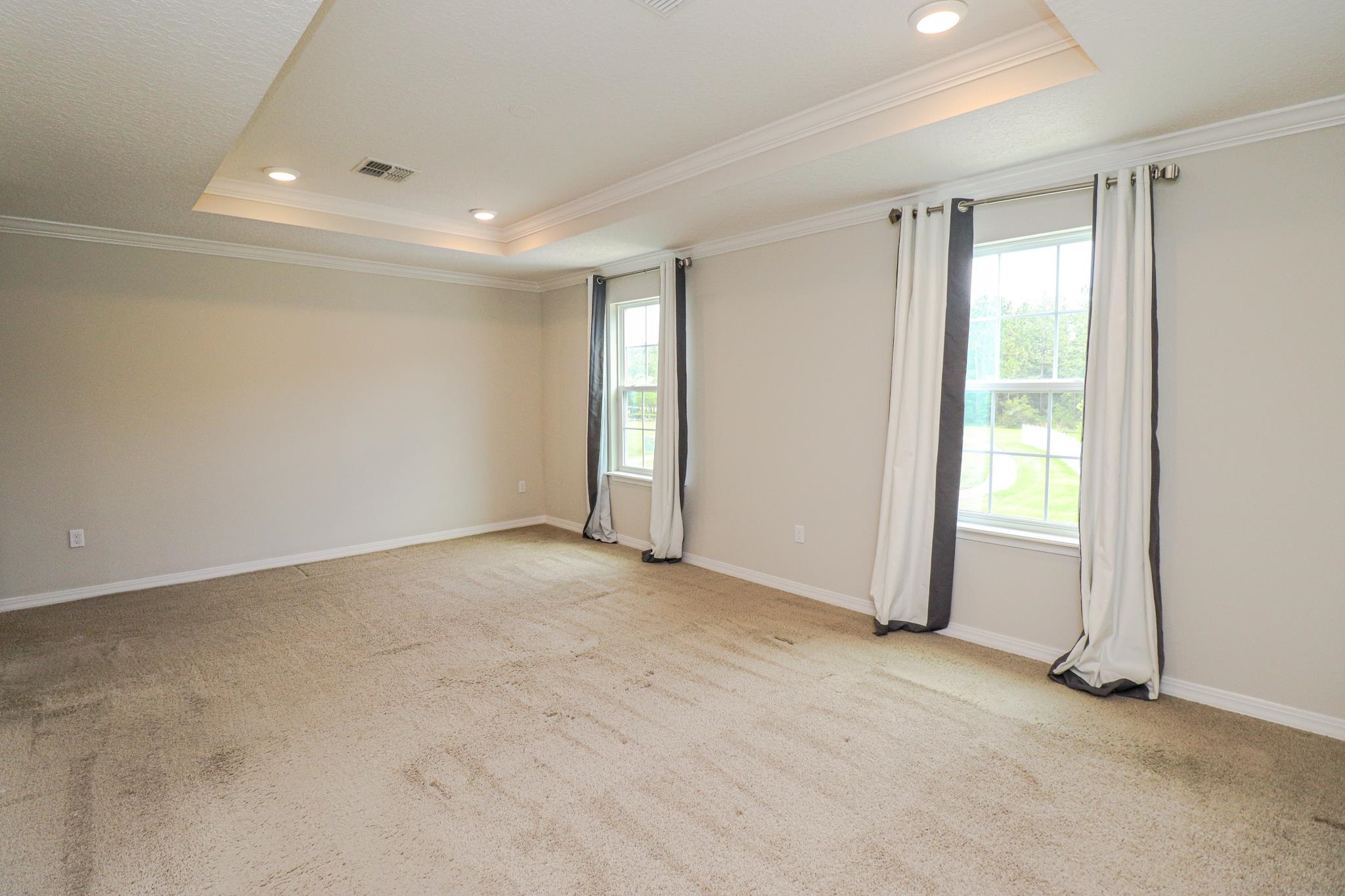 554 Tumbled Stone Way St. Augustine, FL 32086 - Photo 26 of 44 a view of an empty room with a window