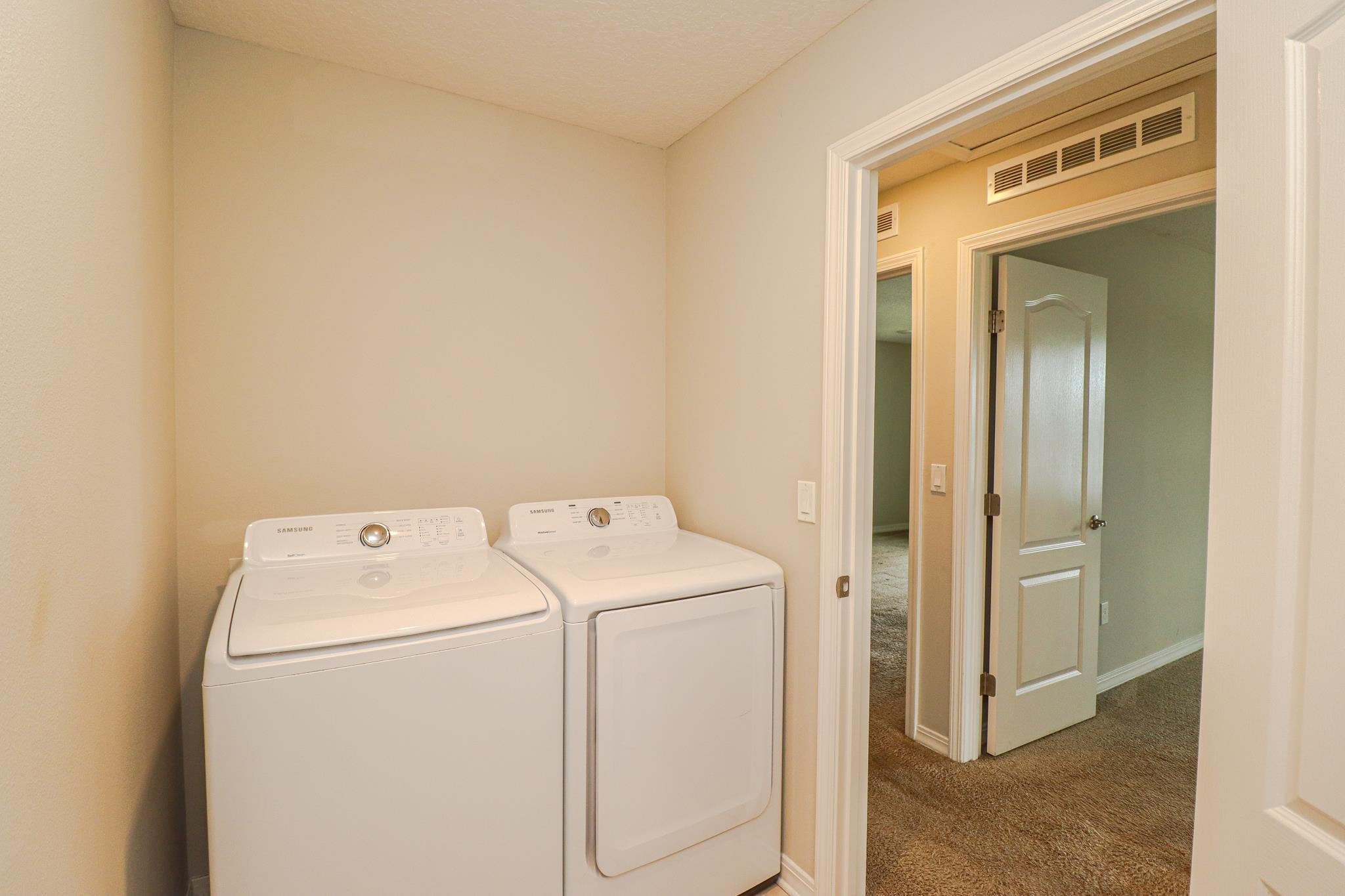 554 Tumbled Stone Way St. Augustine, FL 32086 - Photo 32 of 44 a utility room with dryer and washer
