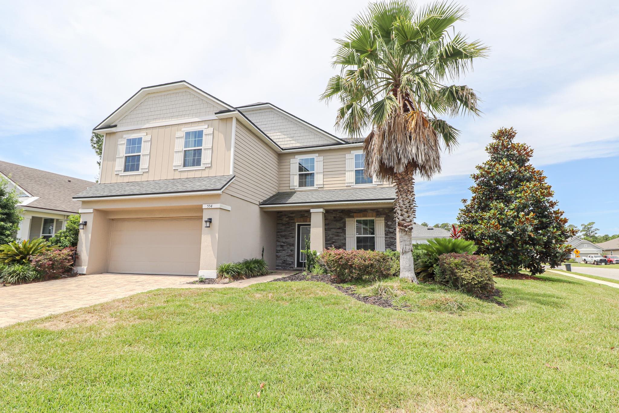 554 Tumbled Stone Way St. Augustine, FL 32086 - Photo 41 of 44 a front view of house with yard and green space