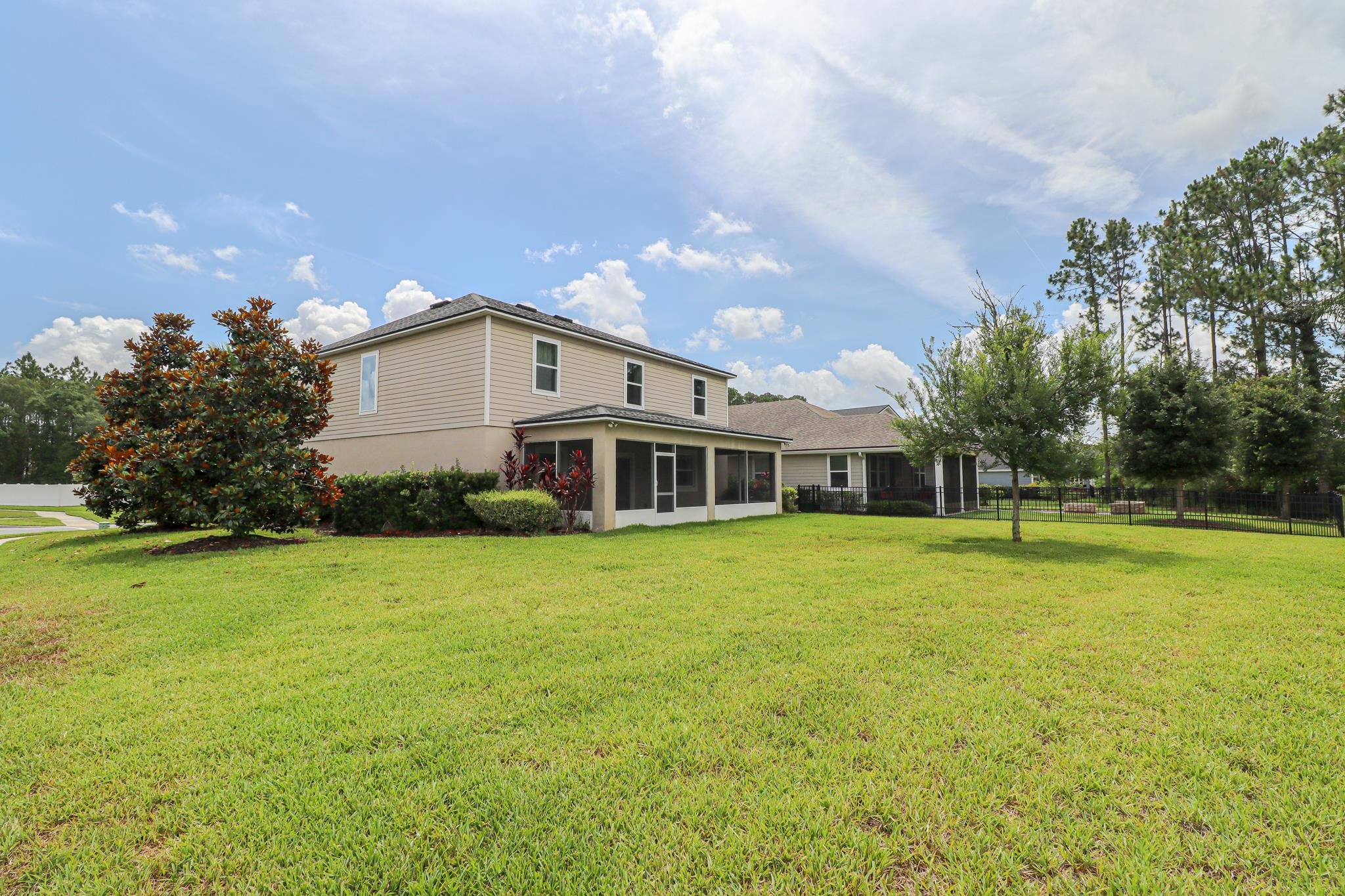 554 Tumbled Stone Way St. Augustine, FL 32086 - Photo 42 of 44 a view of a house with a yard and sitting area