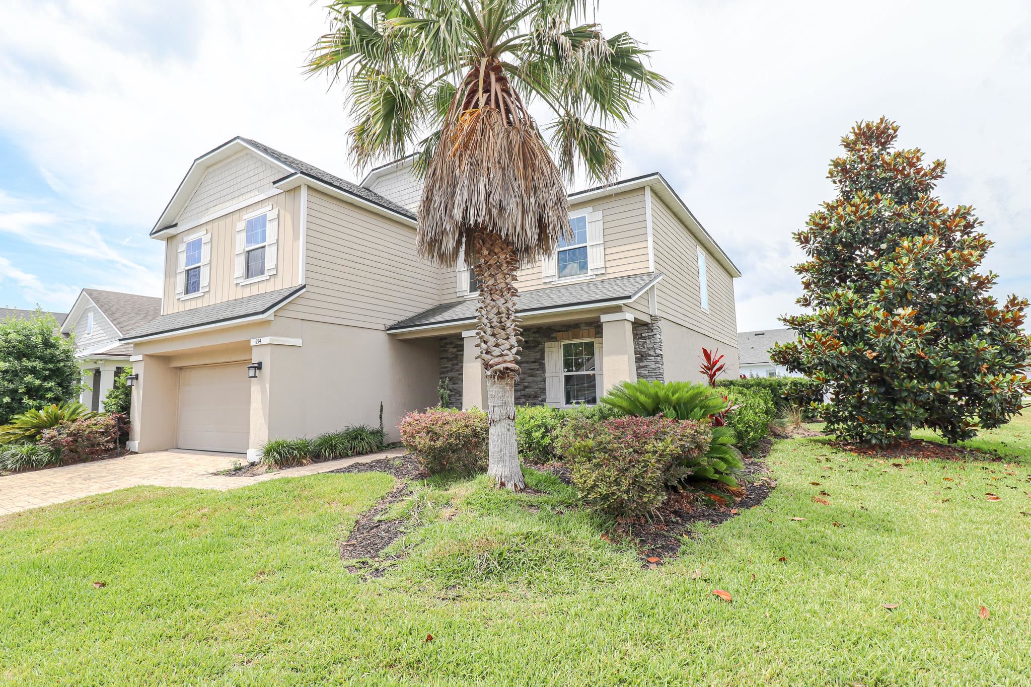 554 Tumbled Stone Way St. Augustine, FL 32086 - Photo 43 of 44 a front view of house with yard and green space